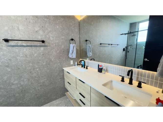 Open gourmet kitchen with granite countertops and stainless appliances in Parque del Mar Costa del Este