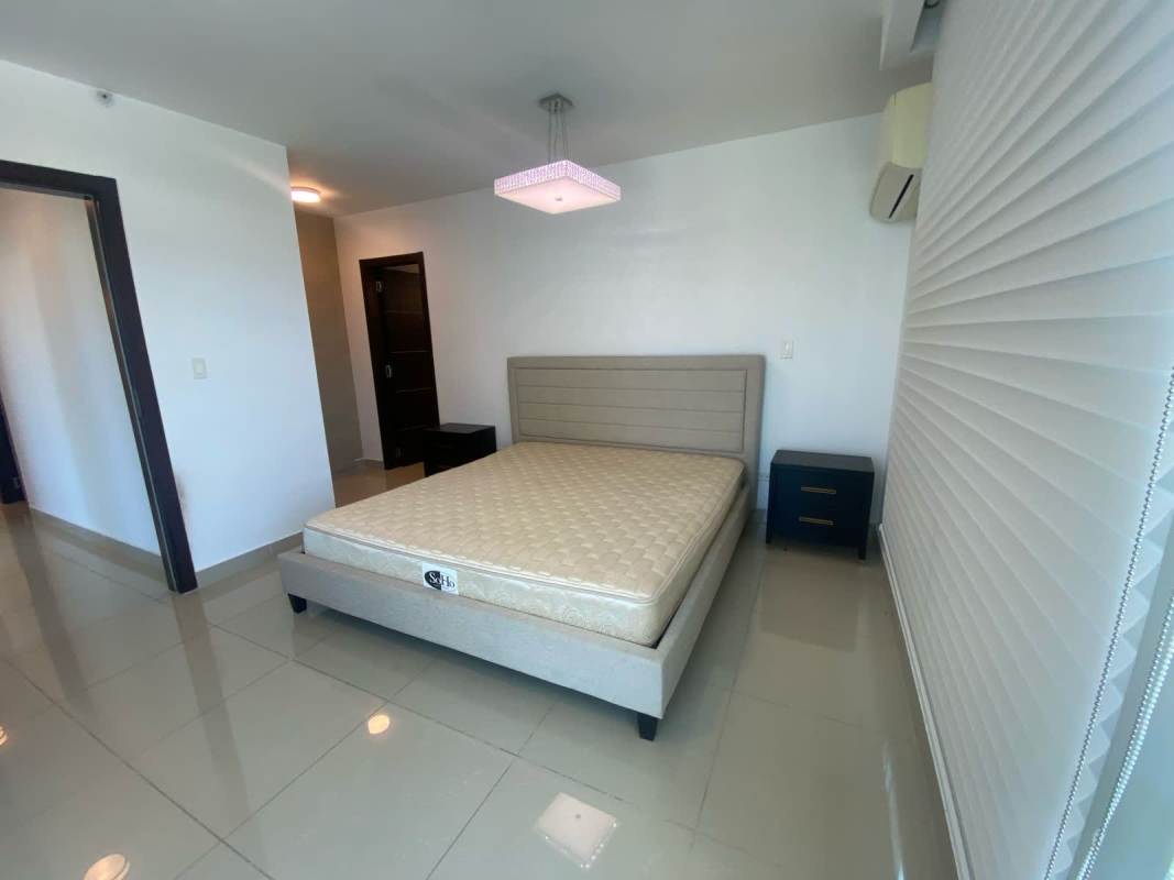 Modern outdoor swimming pool with lounge chairs and skyline views PH Top Tower Costa del Este Panama