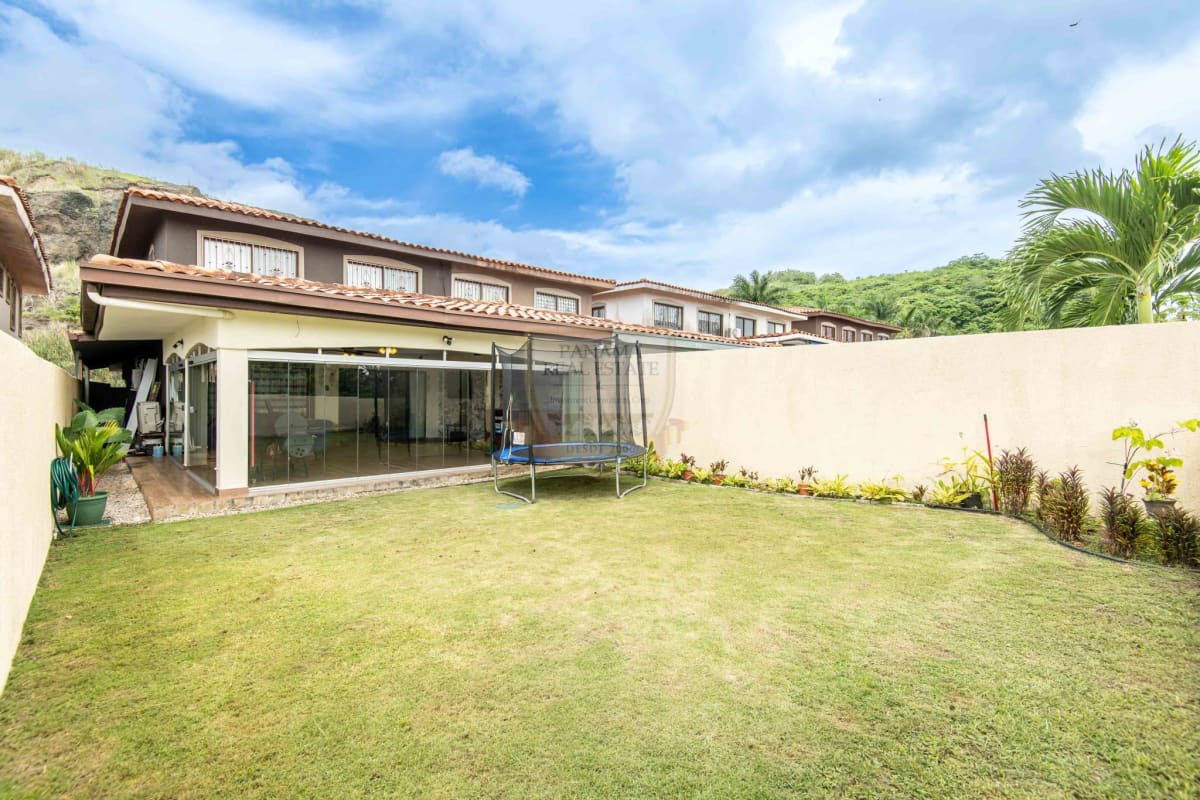 Large glass enclosed terrace with entertainment area in Green Village house San Miguelito