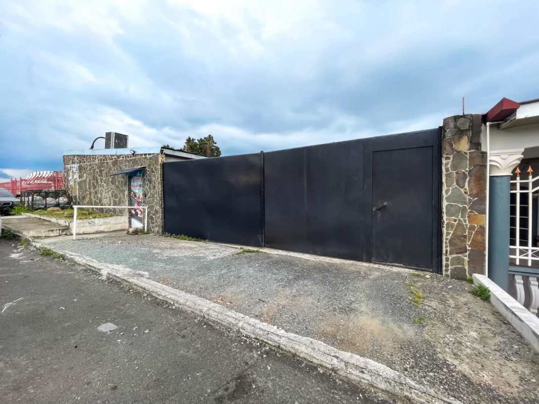 Large metal gate and entry access of commercial lot warehouse in Llano Bonito Panama