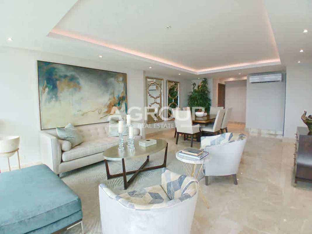 Luxury living and dining room with marble floors and panoramic views in The Colonial Santa Maria Panama