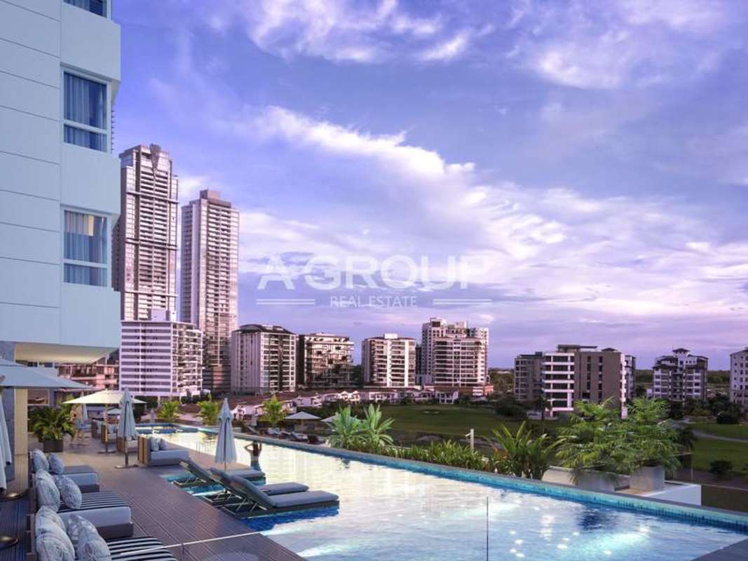 Infinity swimming pool with city skyline and sunset view at luxury PH Guayacán in Santa María