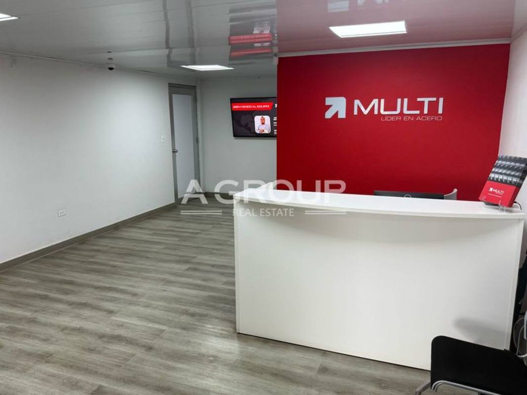 Employee break room kitchenette with tables and cabinets inside industrial warehouse Panama