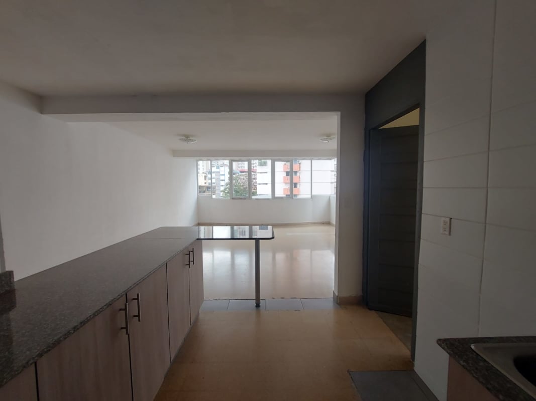 Open modern kitchen with granite countertops and breakfast area at PH Vista Hermosa Via Argentina