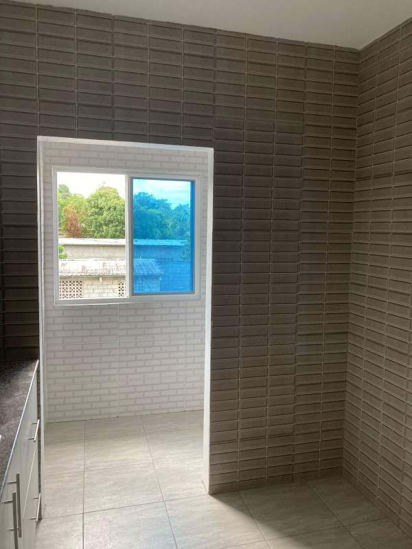 Modern kitchen granite counters, ceramic backsplash in Villa Lua Panama City