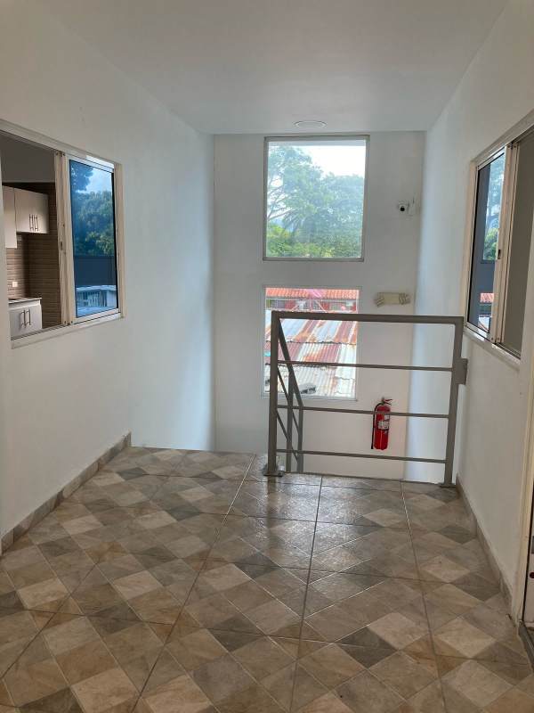 Lobby area with stairs and windows in PH Villa Lua Tocumen Panama