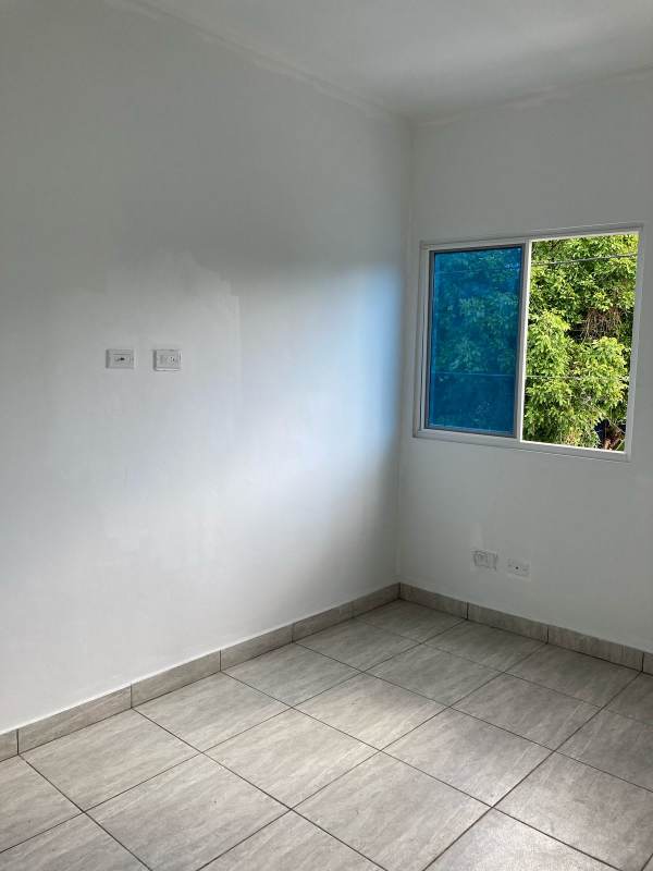 New kitchen with granite countertop and tile wall at PH Villa Lua Tocumen Panama