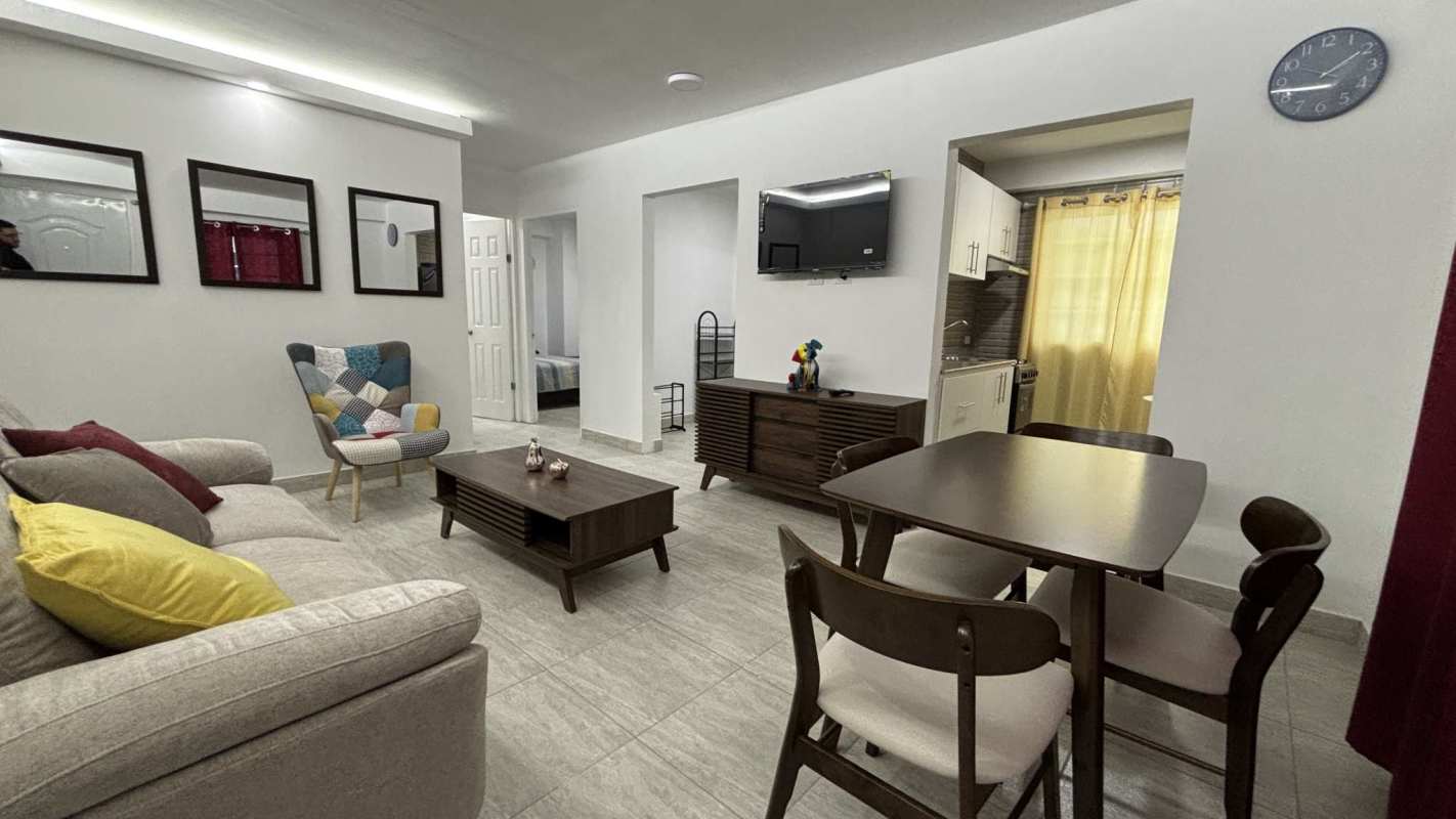 Compact kitchen with granite counter, microwave, stove and large window PH Villa Lua Panama City