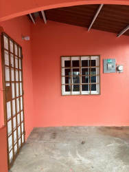 Covered entry porch coral walls glass panel door La Pradera La Chorrera Panama