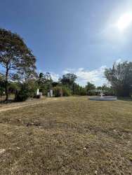 Outdoor covered terrace surrounded by mature trees and garden in Penonomé ranch