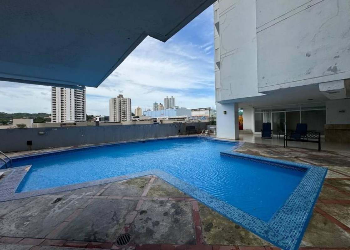 Outdoor swimming pool on terrace with city buildings background at PH Golden Boulevard El Dorado Panama