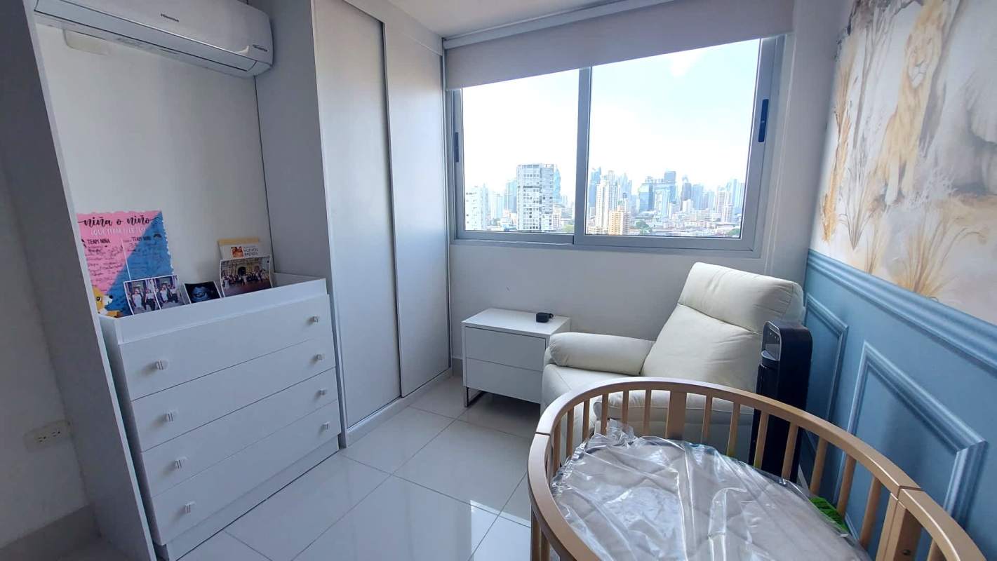 Modern compact kitchen with granite counters and white cabinetry in Panama City