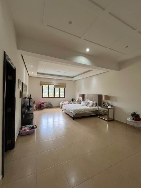 Covered outdoor gourmet kitchen and BBQ with granite counters in luxury home in Costa del Este Panama