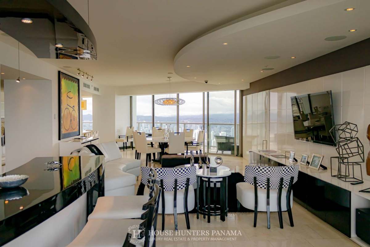 Contemporary kitchen with granite countertops, stainless appliances and skyline view at JW Marriott Panama penthouse