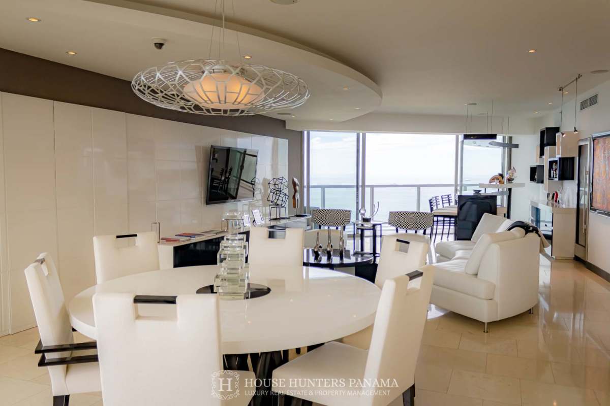 Luxury open concept living dining room with panoramic ocean views in JW Marriott Panama penthouse