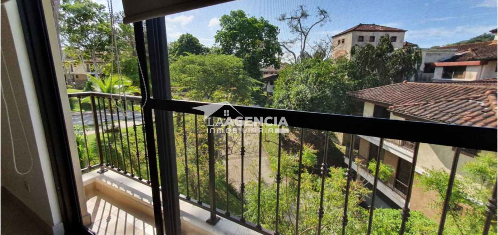 View of clubhouse, swimming pools and tennis courts at Embassy Club Panama
