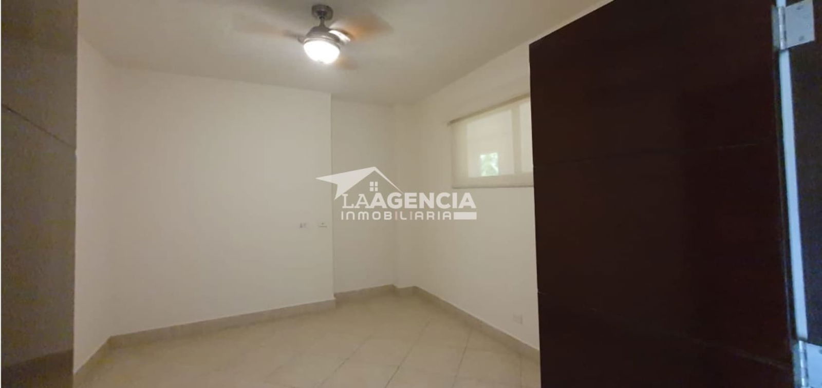 Bedroom with large window, walk-in closet and green views in Embassy Club Panama