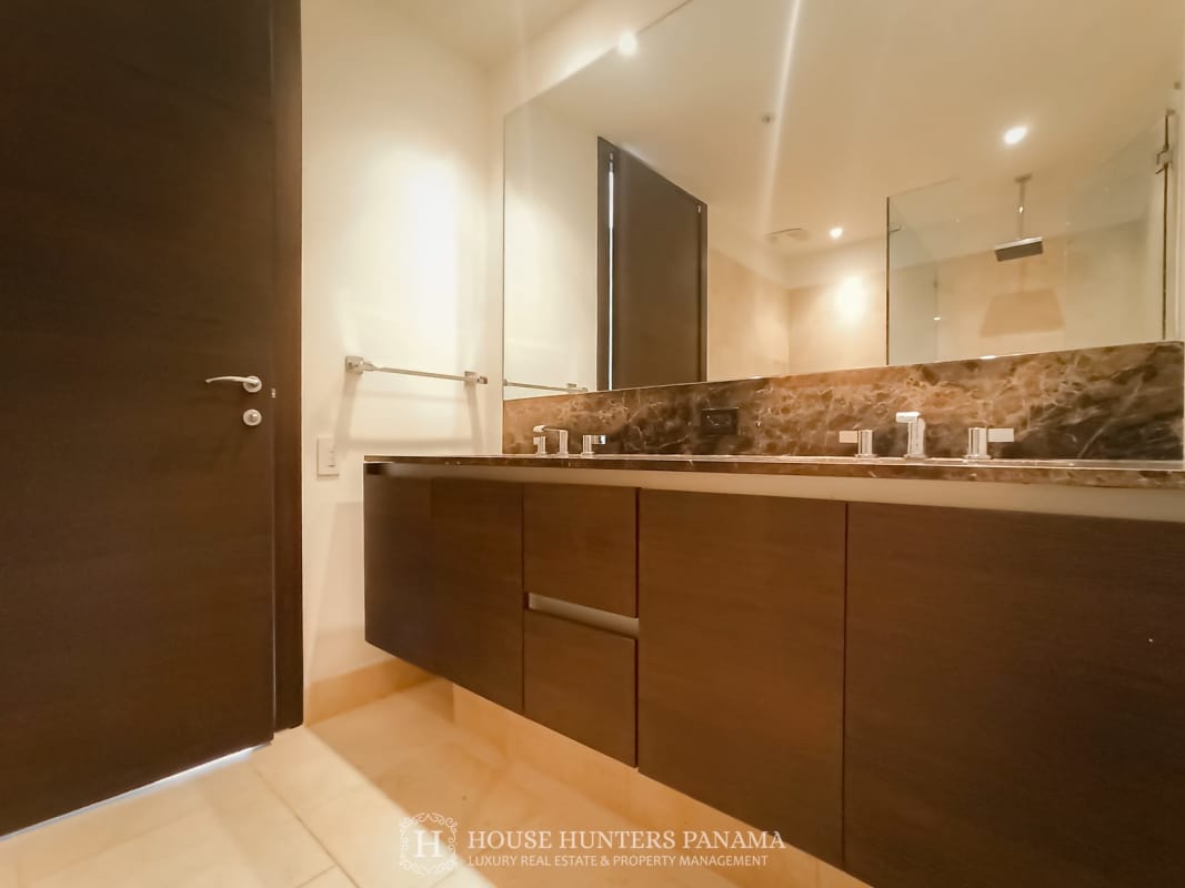 Large master bedroom with ocean view floor-to-ceiling windows in Punta Pacifica Panama City