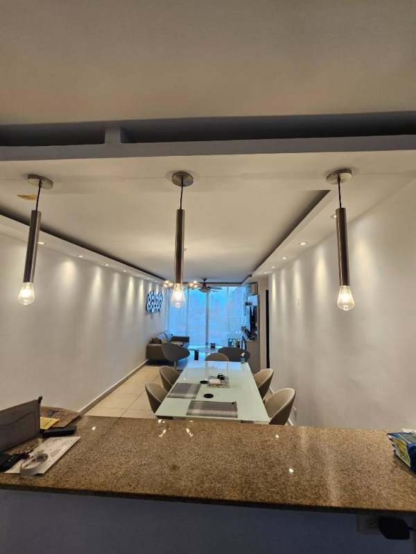 Spacious bedroom with workspace, blue accent wall, large window, split AC in PH Parklane Tower Panama