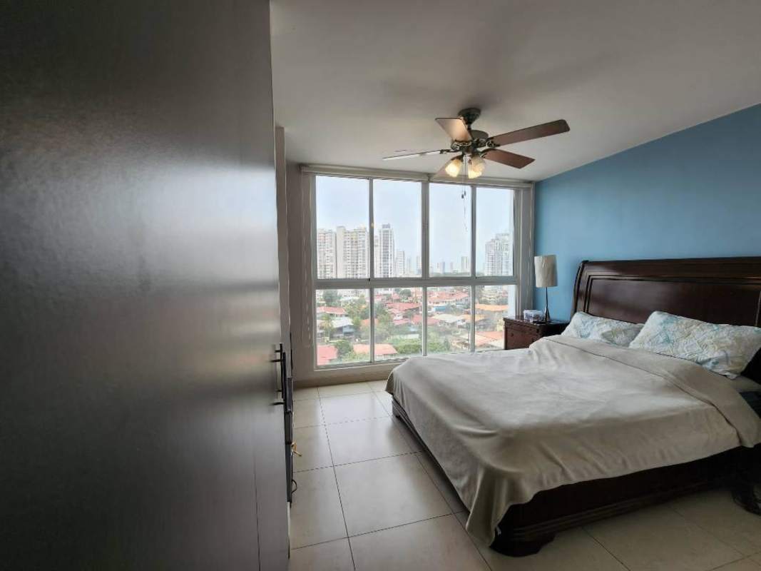 Master bedroom with large windows city skyline and park views PH Parklane Tower Panama