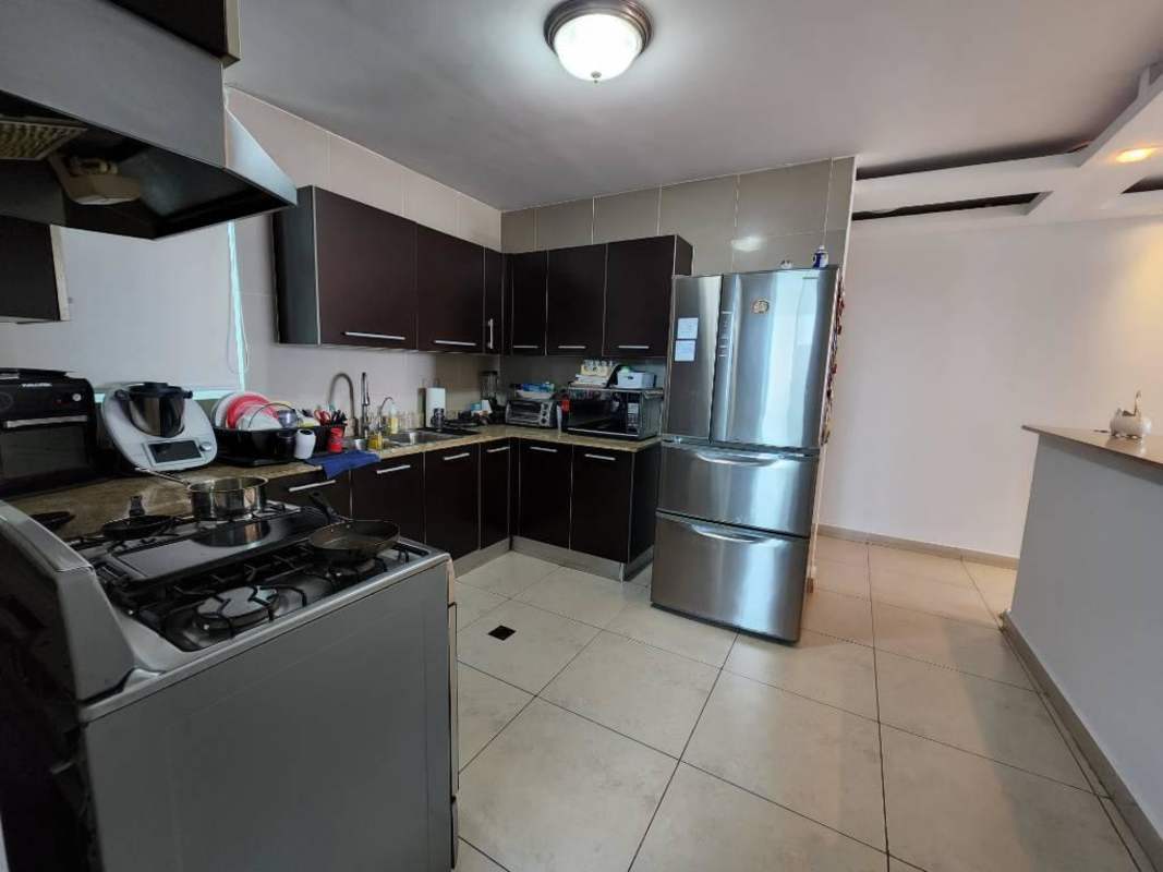 Kitchen with granite countertops, stainless appliances, dark cabinetry PH Parklane Tower Hato Pintado