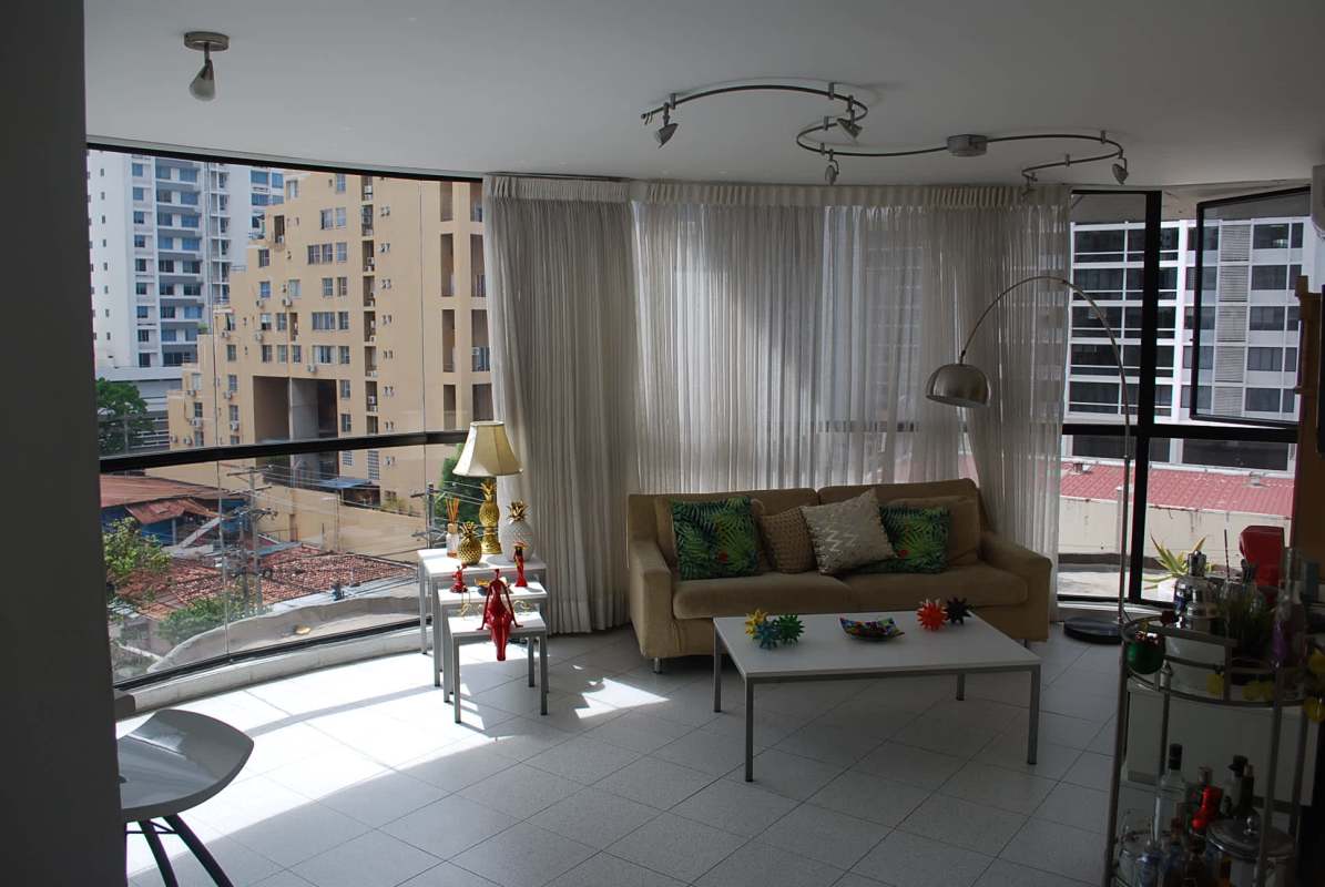 Spacious living with curved panoramic windows and city skyline views PH Coco del Mar Panama