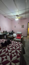 Living area of house in Chitré with sofa set and traditional details listed with Hola Realty