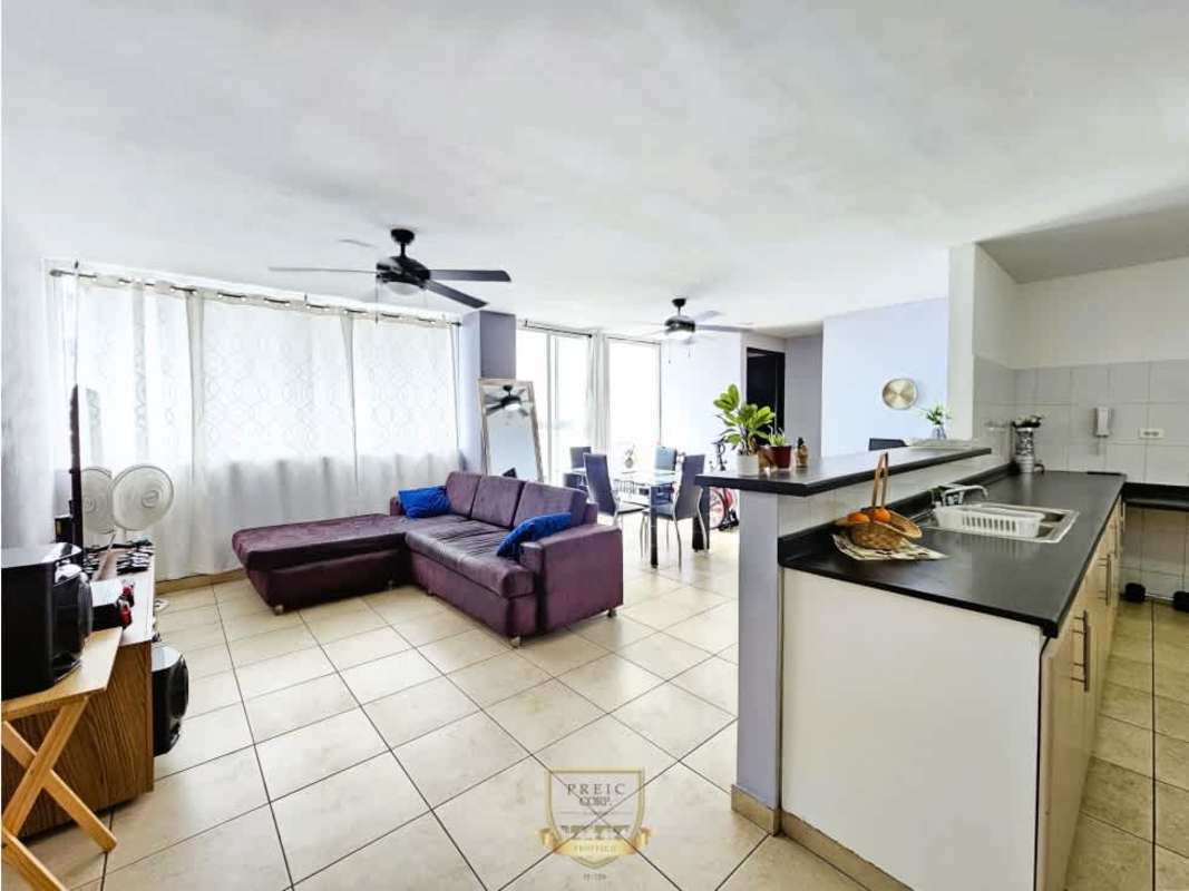 Bright living and dining area with large windows in PH Rim Tower on 12 de Octubre