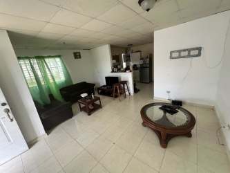 Contemporary living dining area with sofa, tiled floors at Quintas del Pacífico house Panama Oeste