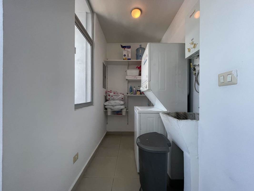 Spacious furnished bedroom with panoramic windows and ensuite bath at PH San Francisco Tower Panama