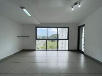 Bright living room with sliding doors to balcony at PH Mosaic Howard Panama Pacifico