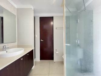 Bathroom with glass shower granite vanity PH Mosaic Howard Panama Pacifico