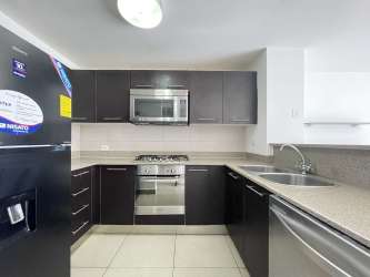 Cozy bedroom with a large window and walk-in closet PH Mosaic Panama Pacifico Howard Panama
