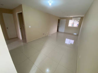 Empty living room with ceramic tiles and window in Brisas del Campo Panama