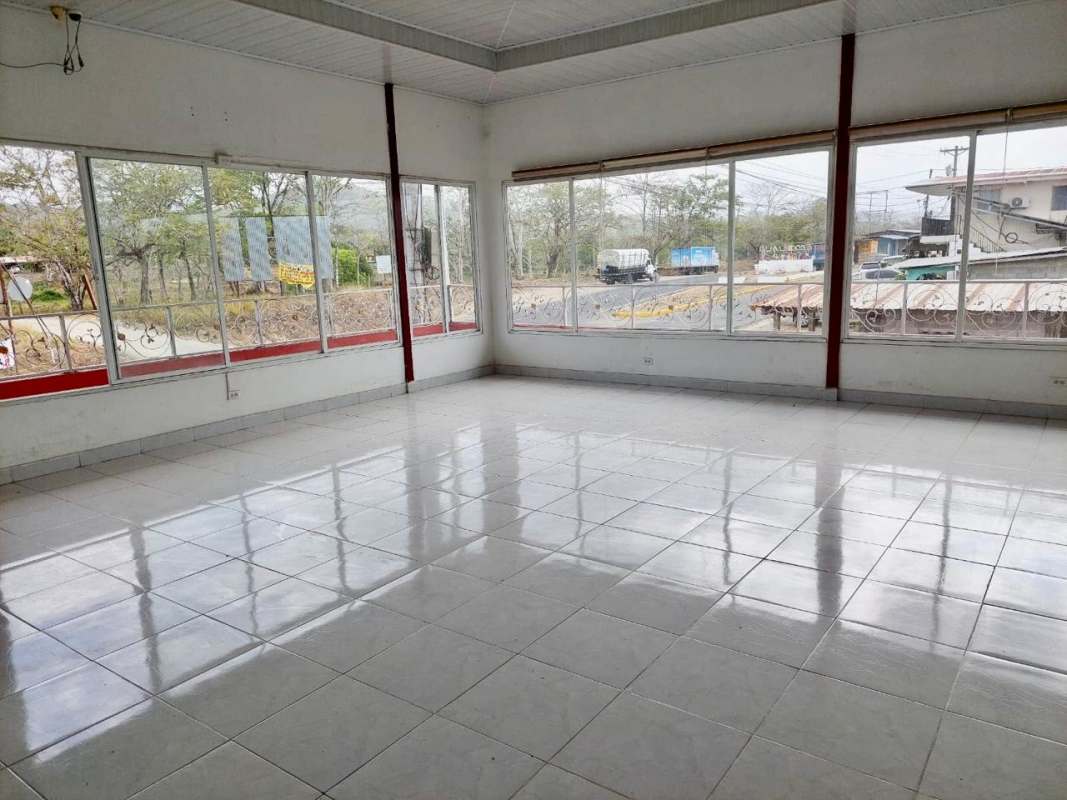 Long balcony with metal railing wicker chairs facing street Canita Panama