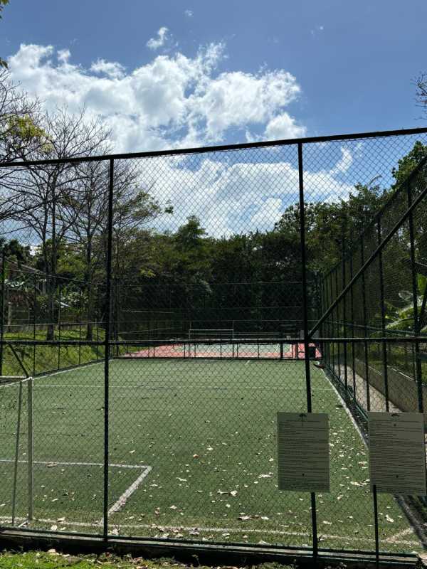 Outdoor tennis and basketball courts with fencing in Embassy Gardens Clayton