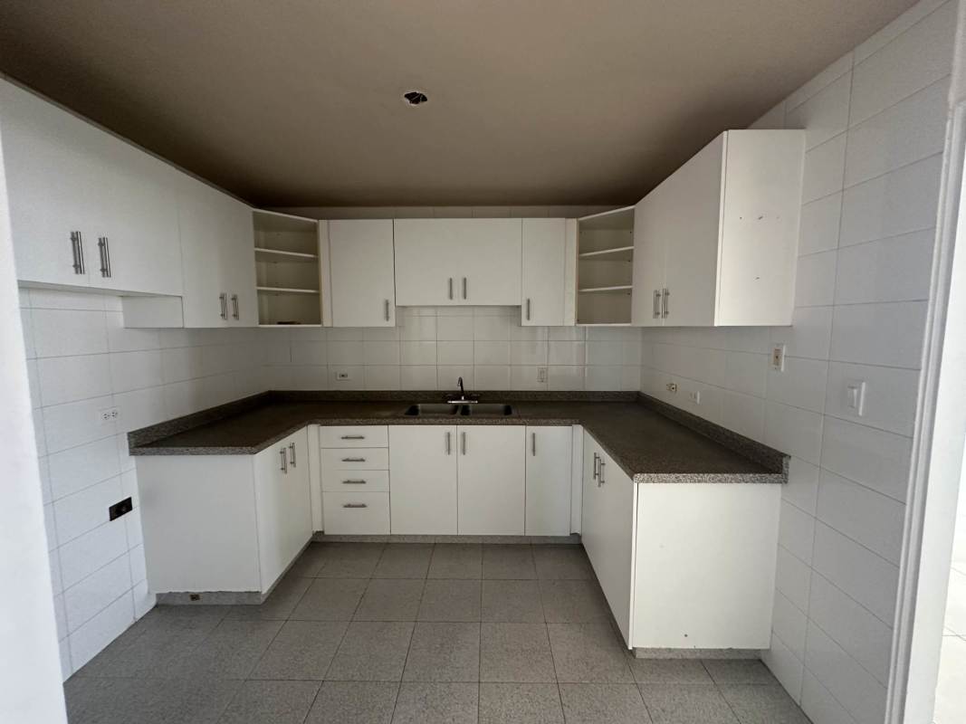 Empty bedroom with tiled floor, window, and built-in closet PH Arrecife Punta Pacífica Panama