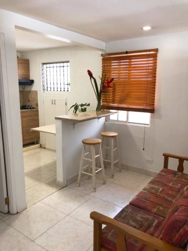 Integrated living, dining and kitchen area with breakfast bar PH El Carmen Panama City