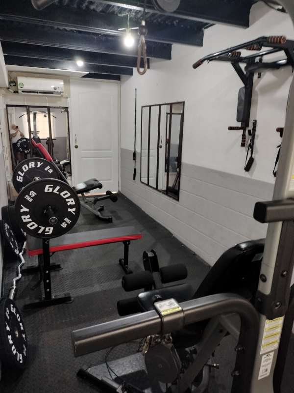 Bright minimalist bedroom zone with windows and blue accents PH El Carmen Panama City