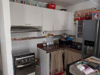 Living and dining area with AC and modern decor in Vacamonte Panama Oeste house for sale