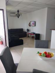 Covered driveway, garden and entry at house for sale Vacamonte Arraiján Panama