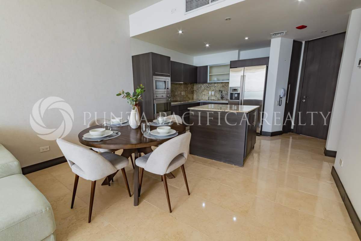 Fully-equipped kitchen with granite counters and stainless appliances in The Ocean Club Punta Pacifica