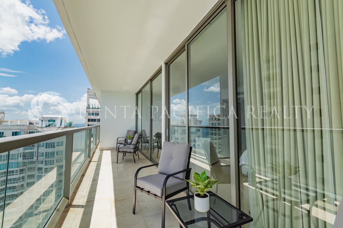 Bright living room with marble floors and panoramic ocean views in The Ocean Club Panama