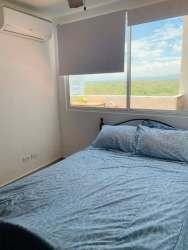 Bright bedroom with large window, AC unit, Playa Corona beachfront condo Panama