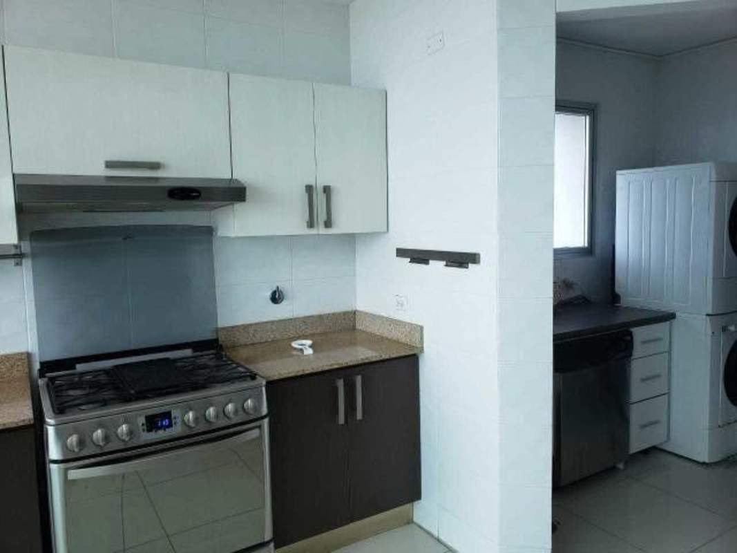Fully equipped modern kitchen with granite countertops and appliances in PH Mystic Tower Panama City