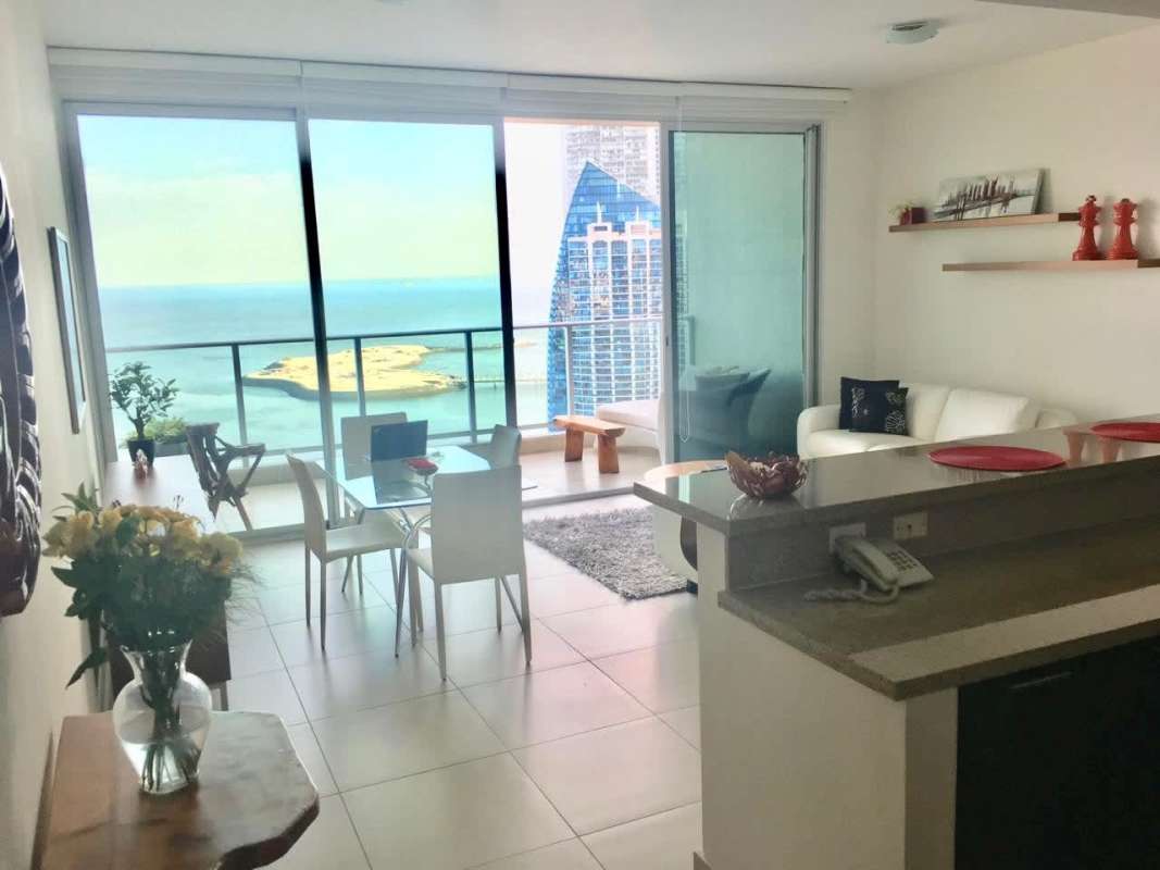 Bright open plan living dining with floor-to-ceiling windows sea view PH Dupont Panama