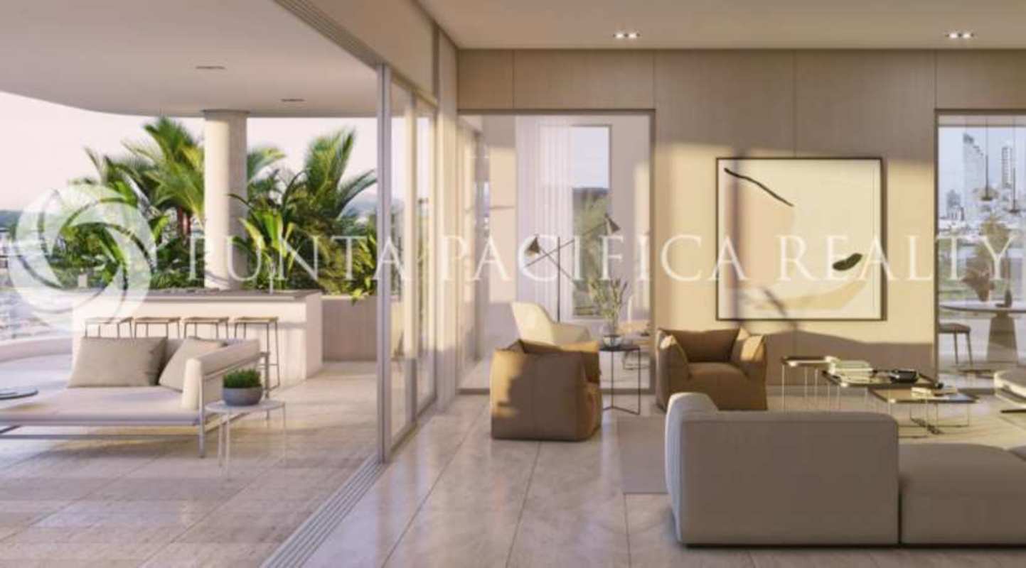 Oceanview pool terrace with sun loungers and tropical landscaping at luxury condo Skyhomes Ocean Reef