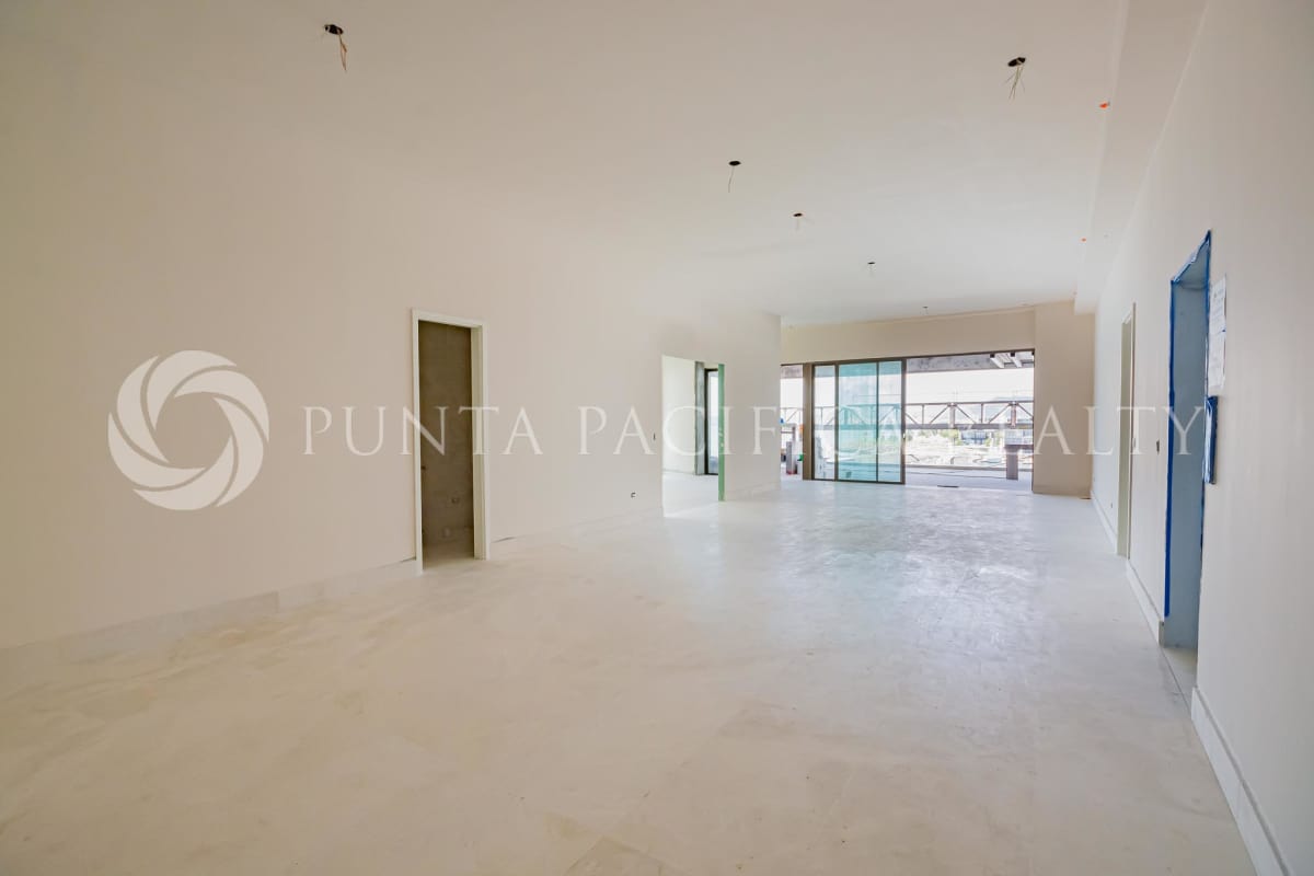 Spacious open area with floor-to-ceiling windows, neutral palette under construction luxury condo PH Skyhomes