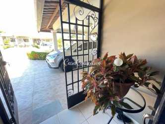 Open dining space connected to modern kitchen with granite countertops in lakefront house San Carlitos Dolega