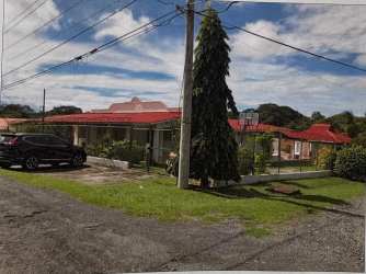House front with garden, driveway and covered walkway in Villa del Sol Chame Panama